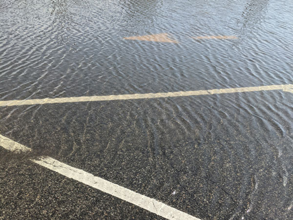 Alpine parking area during high tide